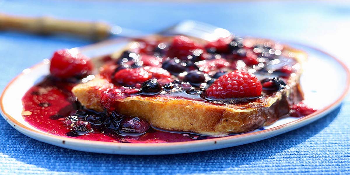 Orange-scented French Toast with Berry Rosemary Sauce